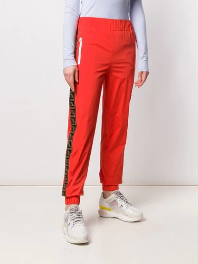 Shop Fendi Logo Stripe Track Pants In Red