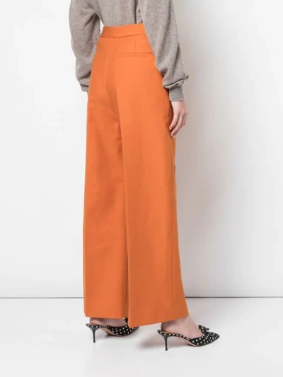Shop Khaite Yasmin Wide-leg Trousers In Orange