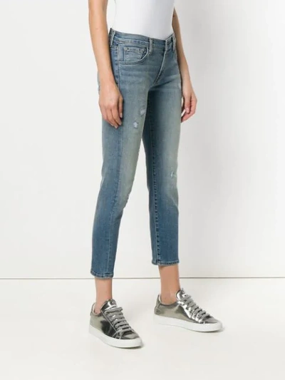 Shop J Brand Distressed Cropped Jeans In Blue