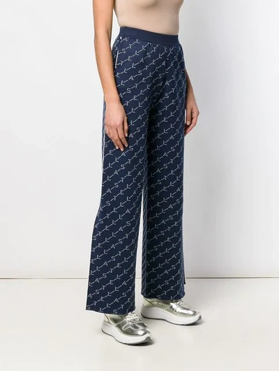 Shop Stella Mccartney Wide Leg Monogram Trousers In Blue