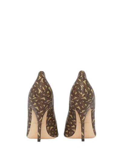 Shop Burberry Monogram Print Pumps In Brown