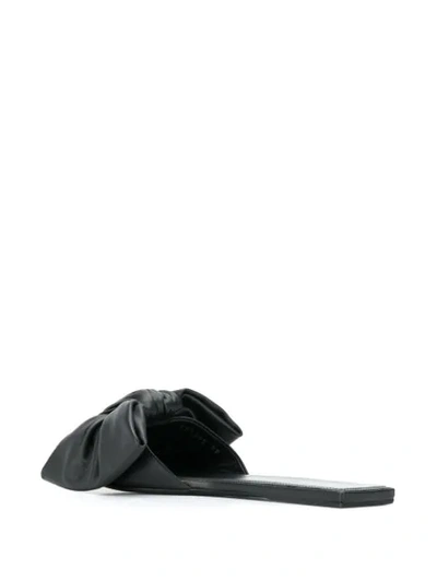 Shop Balenciaga Bow-embellished Slides In Black