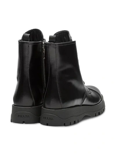 Shop Prada Laced Leather Booties In Black