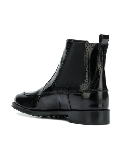Shop Tod's Perforated Trimmed Ankle Boots In 999 Black