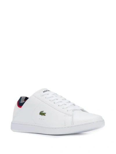 Shop Lacoste Slip-on Logo Sneakers In White