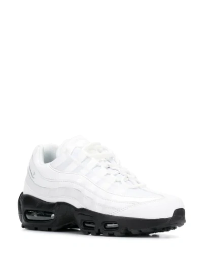 Shop Nike Contrast Sole Sneakers In White