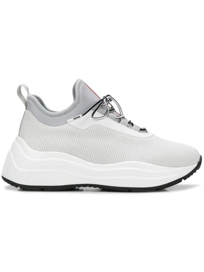 Shop Prada Neoprene Sneakers In White