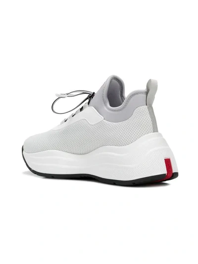 Shop Prada Neoprene Sneakers In White