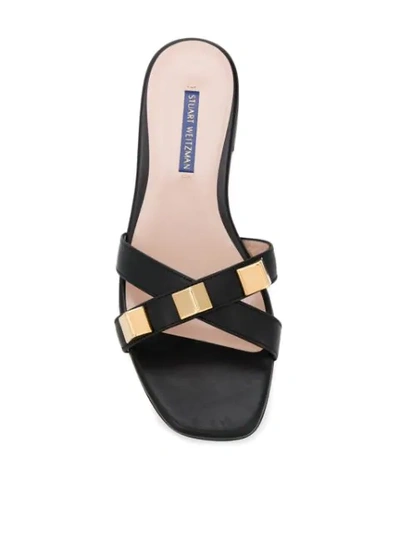 Shop Stuart Weitzman Criss-cross Strap Slides In Black