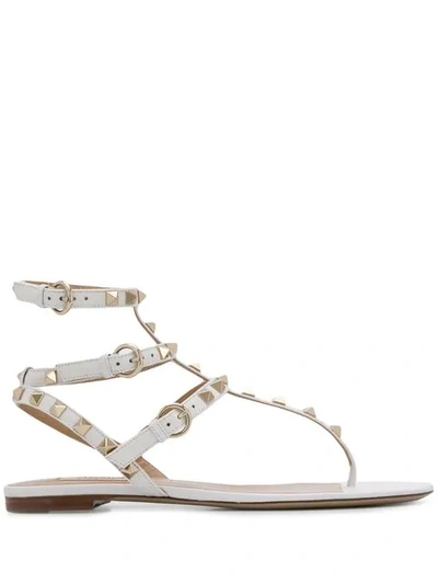 Shop Valentino Rockstud Flat Sandals In White