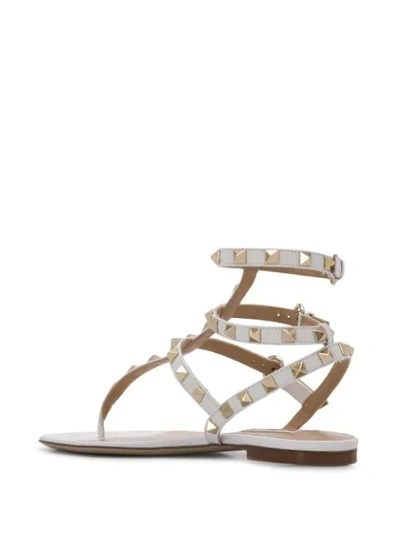 Shop Valentino Rockstud Flat Sandals In White