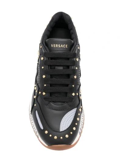 Shop Versace Studded Sneakers In Black
