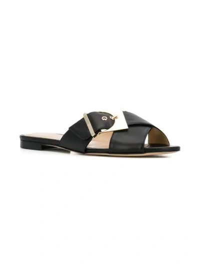 Shop Chloe Gosselin Buckled Flat Mules In Black