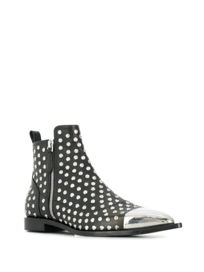 Shop Alexander Mcqueen Studded Ankle Boots In Black