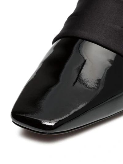 black and white Zygo 15 patent leather flat loafers