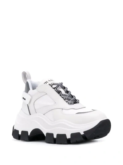 Shop Prada Pegasus Sneakers In White