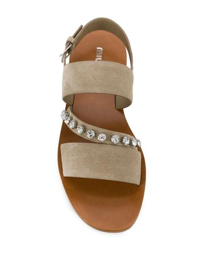 Shop Miu Miu Crystal Embellished Sandals In F0f24