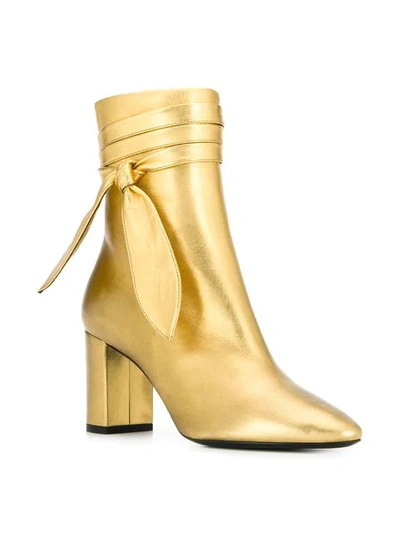 Shop Saint Laurent Ankle Wrap Boots In Gold