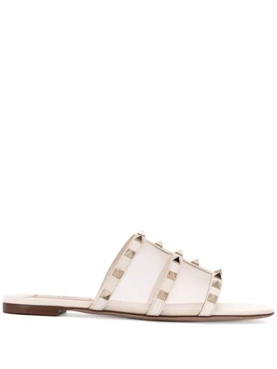 Shop Valentino Garavani Rockstud Slide Sandals In Neutrals