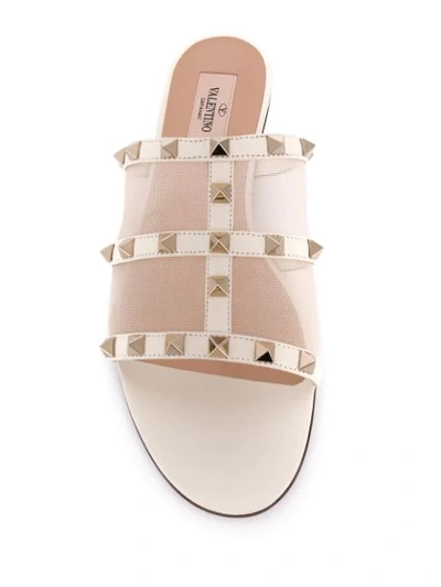 Shop Valentino Garavani Rockstud Slide Sandals In Neutrals