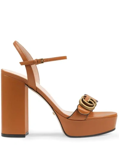 Shop Gucci Gg Plaque Platform Sandals In Brown