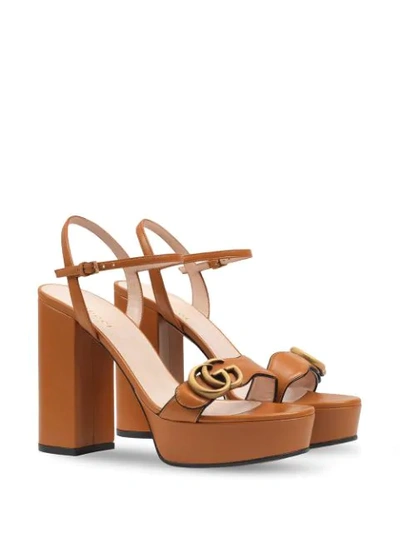 Shop Gucci Gg Plaque Platform Sandals In Brown