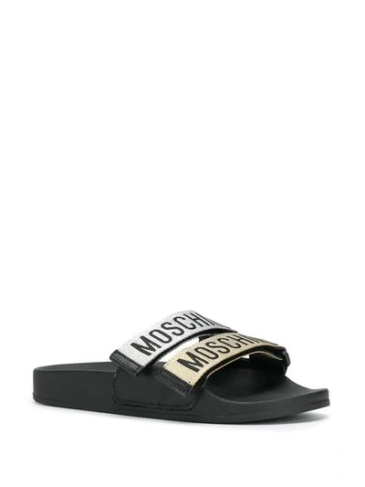 Shop Moschino Logo Strap Slide Sandals In 90a Balck Gold Silver