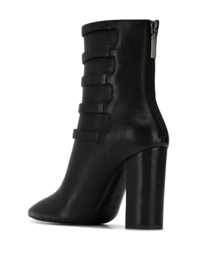Shop Saint Laurent Lou Buckle Strap Ankle Boots In Black