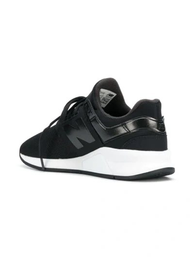 Shop New Balance 247 Low Top Trainers - Black