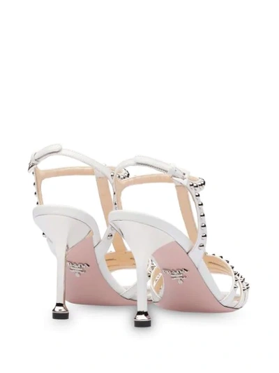 Shop Prada Studded T-strap Sandals In White