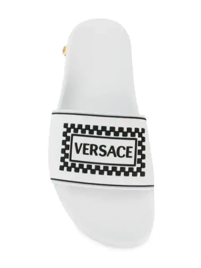Shop Versace Logo Pool Slides In White