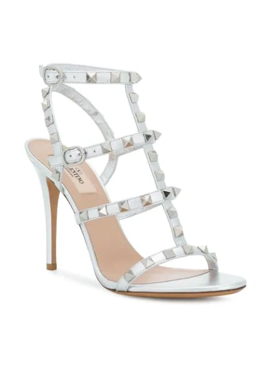 Shop Valentino Rockstud Sandals In Metallic