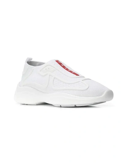 Shop Prada Slip-on Sneakers - White