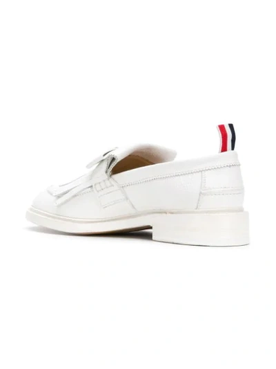 Shop Thom Browne Pebbled Leather Fringe Bow Loafer In White