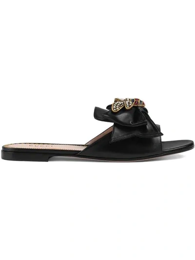 Shop Gucci Leather Slides With Bow In Black