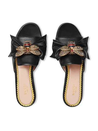 Shop Gucci Leather Slides With Bow In Black