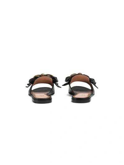 Shop Gucci Leather Slides With Bow In Black