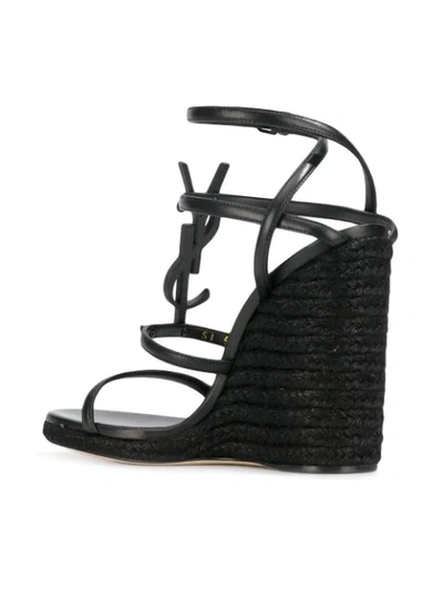 Shop Saint Laurent Cassandra Wedge Sandals In Black