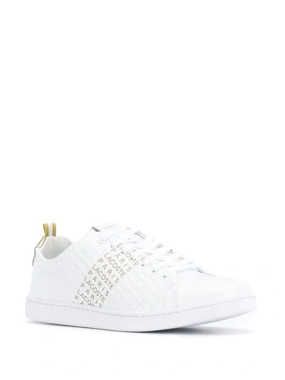 Shop Lacoste Carnaby Evo Sneakers In White