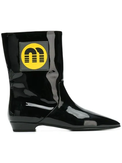 Shop Miu Miu Logo Patch Ankle Boots In Black