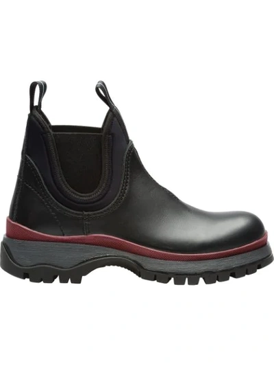 Shop Prada Sawtooth Sole Boots In Black