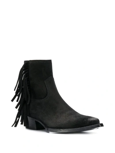 Shop Saint Laurent Lukas Fringed Boots In Black