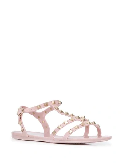 Shop Valentino Rockstud Flat Sandals In Pink