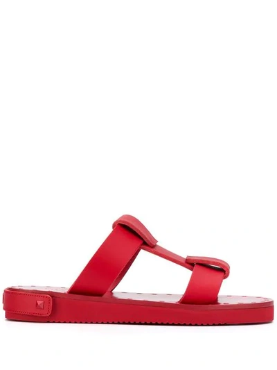 Shop Valentino Rockstud Flat Sandals In Red