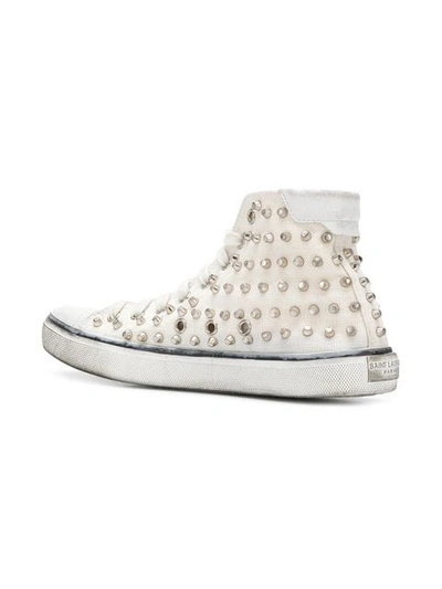 Shop Saint Laurent Bedford Studded Sneakers In White