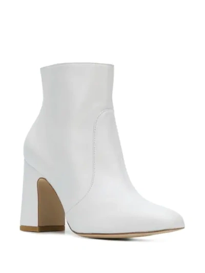 Shop Stuart Weitzman Nell Heeled Ankle Boots In White