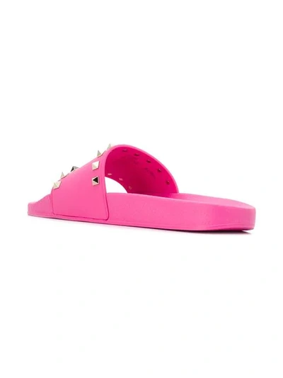 Shop Valentino Rockstud Slides In Pink