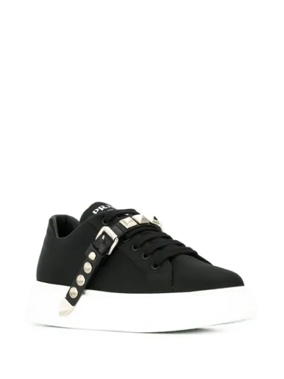 Shop Prada Studded Strap Sneakers In Black