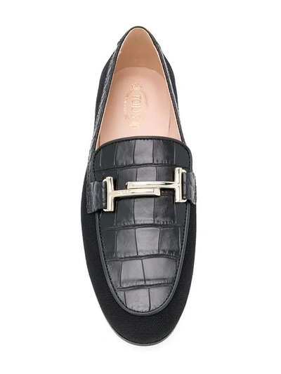 Shop Tod's Flat Appliqué Loafers In Black