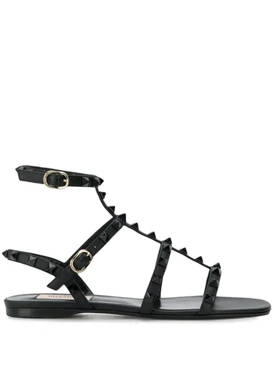 Shop Valentino Rockstud Flat Sandals In Black
